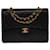 Die begehrte Chanel Timeless/Classic Medium Bag 25 cm mit gefütterter Klappe in schwarzem Leder, garniture en métal doré Lammfell  ref.540115