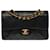 The coveted Chanel Timeless bag 23 cm with lined flap in black leather, garniture en métal doré  ref.545666