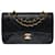 The coveted Chanel Timeless bag 23 cm with lined flap in black quilted lambskin, garniture en métal doré  ref.555152