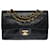 The coveted Chanel Timeless bag 23 cm with lined flap in black leather, garniture en métal doré  ref.556936