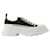 Alexander Mcqueen Tread Slick Sneakers in Black and White Fabric Leather Pony-style calfskin  ref.589445