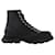 Alexander Mcqueen Tread Slick Sneakers aus schwarzem und silbernem Leder Mehrfarben  ref.590612