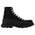 Alexander Mcqueen Tread Slick Boots in Black Leather Cloth  ref.591024