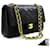 Chanel 2.55 sac à bandoulière à chaîne moyenne à rabat doublé en cuir d'agneau noir  ref.601805