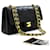 Chanel 2.55 solapa forrada 9"Bolso de hombro con cadena Edredón de piel de cordero negro Cuero  ref.601812