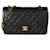 Chanel Vintage Bolso con solapa forrado clásico mediano de piel de cordero negra acolchada Negro Cuero  ref.614377