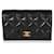 Portafoglio portacarte con patta in caviale trapuntato nero Chanel Pelle  ref.622604