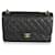 Bolsa Chanel Black acolchoada Caviar Jumbo Classic forrada com aba Preto Couro  ref.632474
