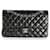 Bolso con solapa con forro clásico mediano de piel de cordero acolchada negra de Chanel Negro Cuero  ref.632694