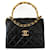 Chanel Clutch aus schwarzem Lammleder mit Überschlagtasche und Henkel Lammfell  ref.669279