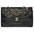 Timeless Magnífico bolso de mano Chanel Classique con solapa forrada en piel de cordero acolchada negra Negro Cuero  ref.687934