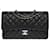 L'iconica borsa media "Must Have" Chanel Timeless 25 cm con patta foderata in agnello trapuntato nero Pelle  ref.748795