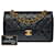 Le "Must Have"Sac Chanel Timeless 23 cm mit gefütterter Klappe aus schwarzem gestepptem Lammfell, Leder  ref.787716