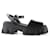 Sandales plates-formes brossées Monolith en cuir noir Prada  ref.792720