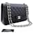 Chanel 11" Grand sac porté épaule à rabat et chaîne doublé en cuir de veau grainé Noir  ref.976715