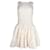 Maje Sleeveless Flared Skirt Mini Dress in Cream Polyester White  ref.1014476
