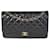 Timeless Bolsa Chanel Black acolchoada em pele de cordeiro Jumbo Classic forrada com aba Preto Couro  ref.1188999