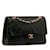 Chanel Mittelgroße klassische gefütterte Überschlagtasche Schwarz Leder Lammfell  ref.1195988