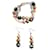 Beautiful luminous set of golden steel and pearls, DOLCE & GABBANA bracelet and earrings with, White pearls, gold and black  ref.1208662