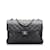 Borsa a tracolla con patta foderata in pelle di agnello classica media nera Chanel Nero  ref.1213529