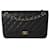Timeless Bolsa Chanel Black acolchoada Caviar Jumbo Classic forrada com aba Preto Couro  ref.1219950