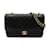 Chanel Bolso mediano con solapa con forro clásico A01112 Negro Cuero  ref.1220396