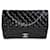 Timeless Bolsa Chanel Black acolchoada de couro envernizado Maxi Classic com aba com forro Preto  ref.1221093