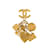 Broche con dijes de icono de Chanel dorado Metal  ref.1228322