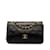 Bolso de hombro con solapa y forro de piel de cordero clásico pequeño Chanel negro Cuero  ref.1238117