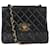 Chanel black 1994 sac porté épaule Classic à rabat simple en cuir d'agneau Noir  ref.1242504