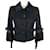 Chanel Nouvelle veste en tweed noir à boutons en camélia CC.  ref.1247741