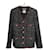 Chanel Chaqueta de tweed negro con icónicos botones de joya CC por 9K$.  ref.1258087