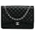 Borsa a tracolla singola con patta nera Chanel Maxi Classic Caviar Nero Pelle  ref.1268377