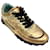 Autre Marque Chanel Dourado Metálico / Tênis cano baixo de couro com logo preto embelezado  ref.1269294