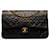 Bolso de hombro con solapa y forro de piel de cordero clásico mediano Chanel negro Cuero  ref.1269778