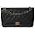 Timeless Bolsa Chanel Black acolchoada Caviar Jumbo Classic forrada com aba Preto Couro  ref.1294610