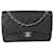 Timeless Bolsa Chanel Black acolchoada Caviar Jumbo Classic forrada com aba Preto Couro  ref.1301118