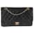 Timeless Bolso con solapa con forro clásico mediano de piel de cordero acolchada negra de Chanel Negro Cuero  ref.1305506