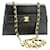 Chanel VINTAGE NEGRO 1989 bolso de hombro pequeño con cadena de piel de cordero Cuero  ref.1306619