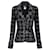 Chanel Nouvelle veste en tweed noire à boutons CC ceinturée.  ref.1312063