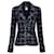 Chanel Nouvelle veste en tweed noire à boutons CC ceinturée.  ref.1388035