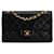 Bolso de hombro con solapa y forro de piel de cordero clásico pequeño Chanel negro Cuero  ref.1392367