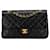 Borsa a tracolla con patta foderata in pelle di agnello classica media nera Chanel Nero  ref.1410625