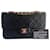 Timeless Bolsa Chanel de couro preto com dupla aba de 23 cm banhada a ouro.  ref.1416699