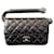 CHANEL Bolsa de mão matelassé em pele de cordeiro preta Earth 18 com hardware gunmetal, fecho de giro Coco Mark. Preto Couro envernizado  ref.1484986