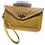 Autre Marque Pochette in vera pelle marocchina con design floreale inciso e cinturino da polso Senape