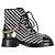 Timeless Botas de combate em couro preto e branco com padrão de tweed e logo CC entrelaçado da Chanel