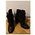 Botas de tornozelo Valentino em couro preto com flores e fivela - vista 2