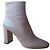 BOTINES PRADA CON TACÓN EN CUERO GRIS.