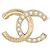 Spilla Chanel in metallo dorato champagne e strass D'oro